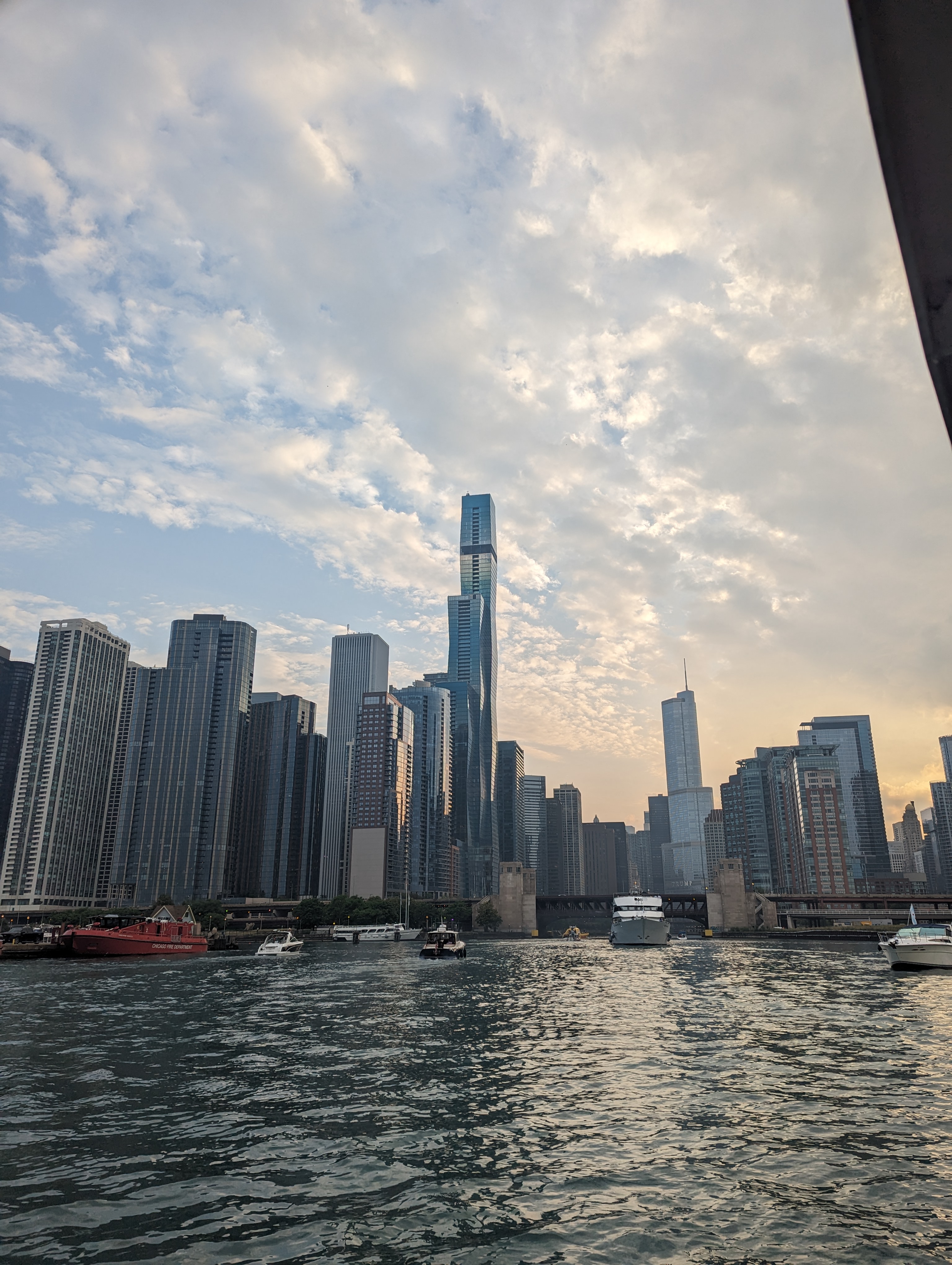 The skyline of Chicago as seen from the Chicago river basin (area just before the locks connecting it to lake Michigan). In the center of the shot is the St. Regis (tallest building in the world with the lead architect being a woman) and off to the right is trump tower.